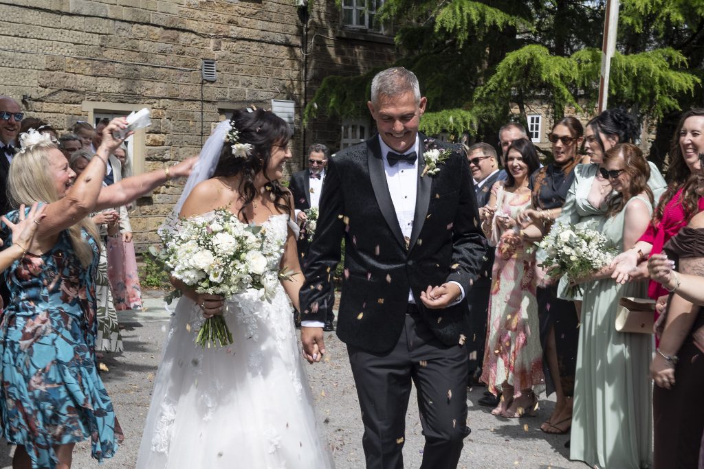 Bride and groom with confetti